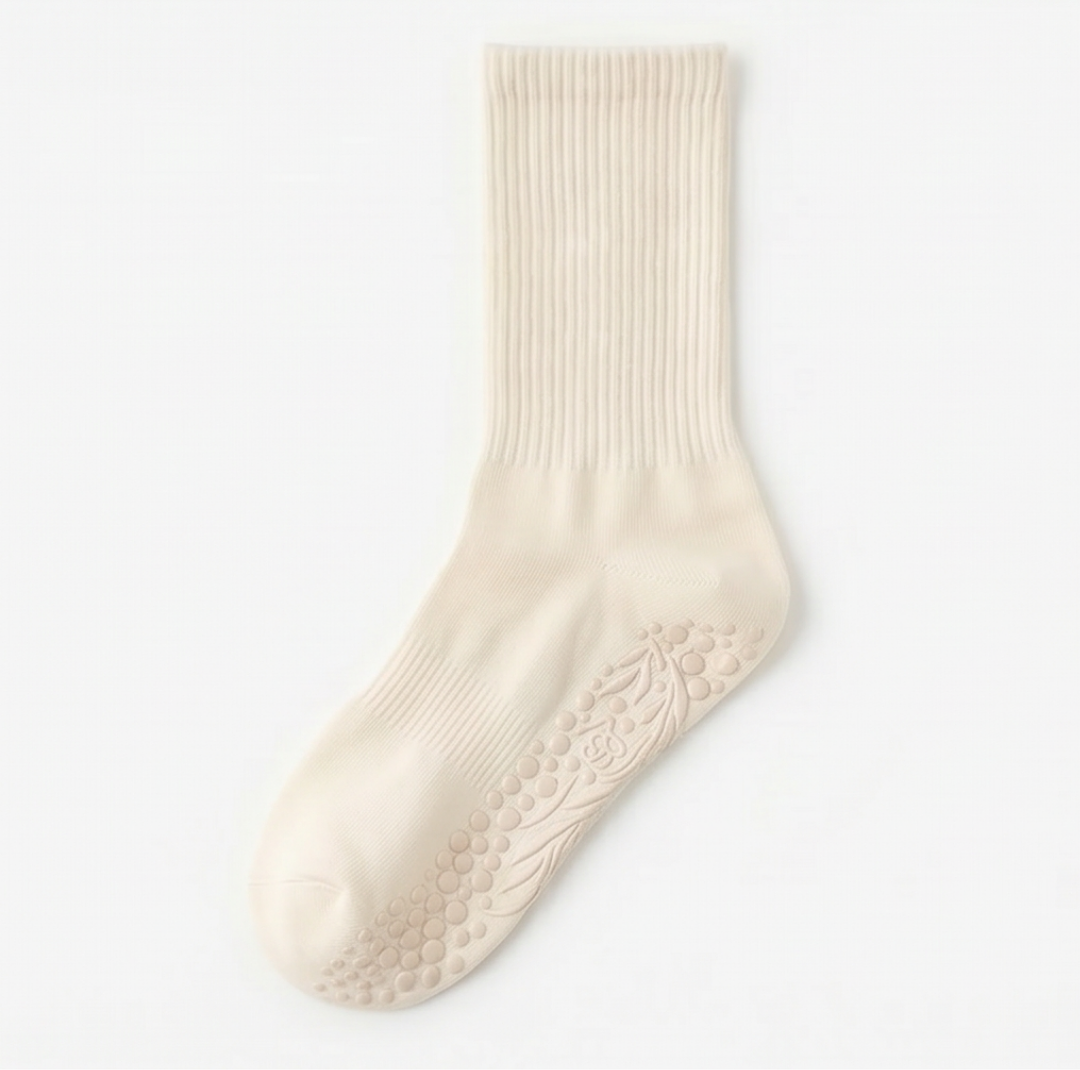Beige Bellona Velvet Pilates socks with grip soles, minimalist design, made of organic cotton, for enhanced grip during workouts.
