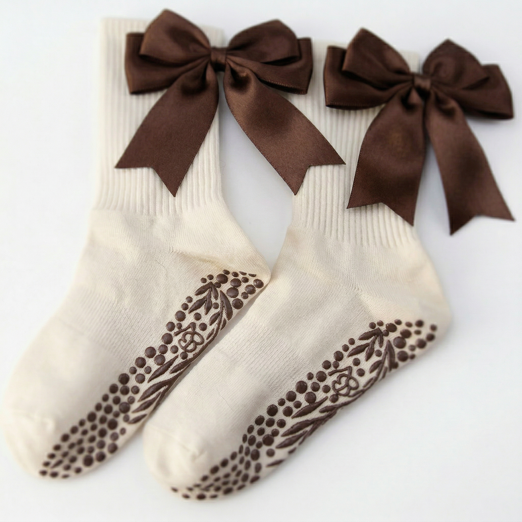 Deep brown organic cotton Pilates grip socks featuring a sophisticated minimalist ankle bow and traction-engineered dual grip lining by Bellona Velvet.
